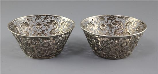 A pair of late 19th/early 20th century Chinese Export pierced repousse silver bowls, 8.5 oz.